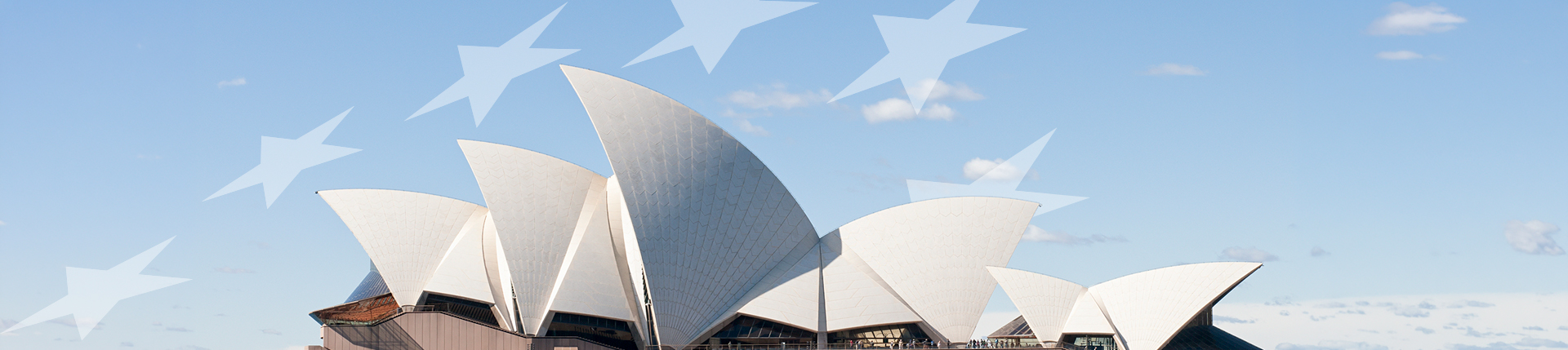 Ópera de Sídney con diseño de estrellas inspiradas en la bandera australiana sobre un cielo azul, símbolo de la cultura y el turismo en Australia.
