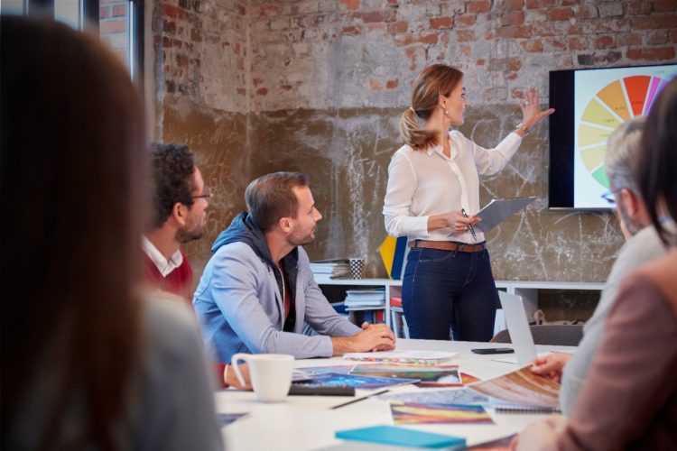 Businesswoman holding presentation at a meeting with colleagues in the office