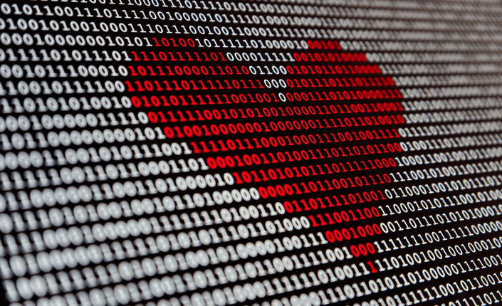 Corazón rojo realizado con ceros y unos