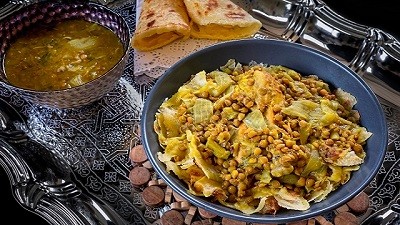 Traditional Homemade Moroccan Chicken Rfissa with onions and lentils.