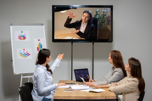 Meeting. Young women talking, working in videoconference with colleagues, co-workers at office or living room. Online business, education during insulation, quarantine. Work, finance, tech concept.